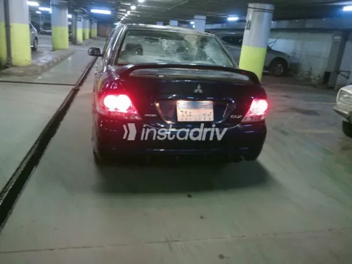 ميتسوبيشي لانسر 2009 أبيض مستعملة للبيع - 1