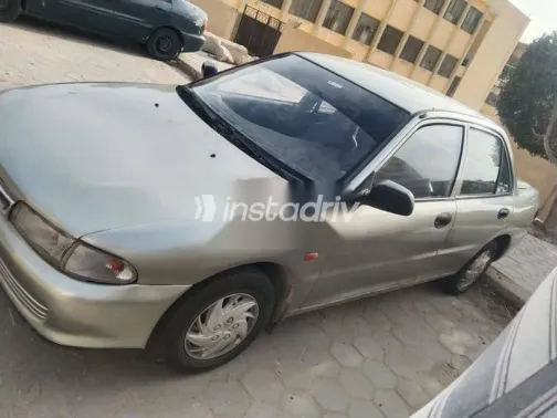 ميتسوبيشي لانسر 1994 فضي مستعملة للبيع - 4