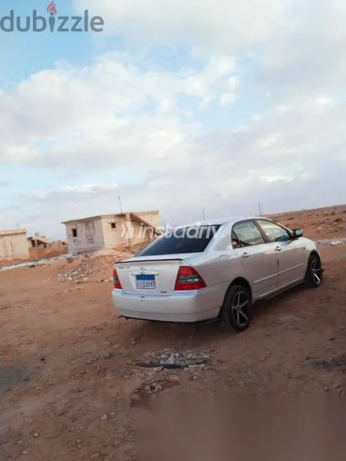 تويوتا كورولا 2002 أبيض مستعملة للبيع - 7