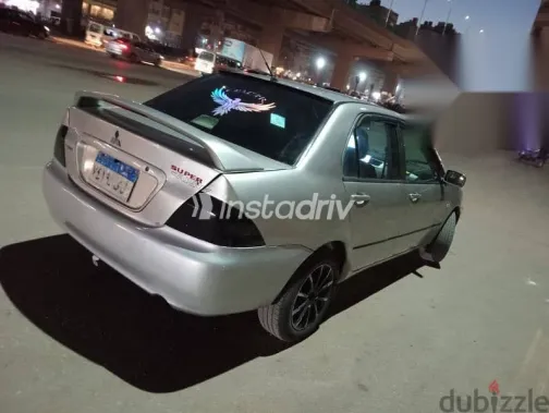 ميتسوبيشي لانسر 2009 فضي مستعملة للبيع - 4