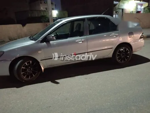 ميتسوبيشي لانسر 2009 فضي مستعملة للبيع - 7