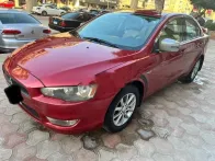 ميتسوبيشي لانسر 2016 أحمر مستعملة للبيع