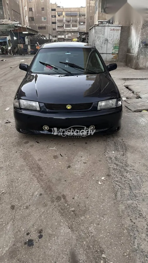 مازدا 323 1997 أزرق غامق مستعملة للبيع - 2