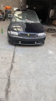 مازدا 323 1997 أزرق غامق مستعملة للبيع