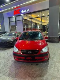 هيونداي جيتز 2010 أحمر مستعملة للبيع