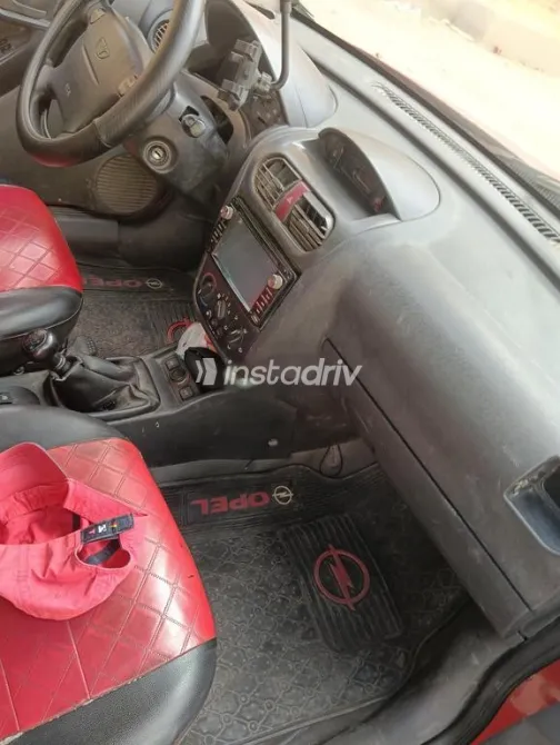 اوبل كورسا 2003 أحمر مستعملة للبيع - 3