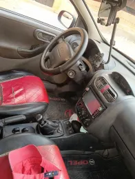 اوبل كورسا 2003 أحمر مستعملة للبيع