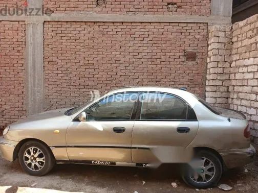 دايو لانوس 1999 ذهبي مستعملة للبيع - 1