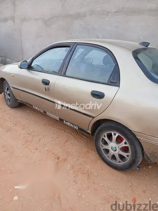 دايو لانوس 1999 ذهبي مستعملة للبيع - 10