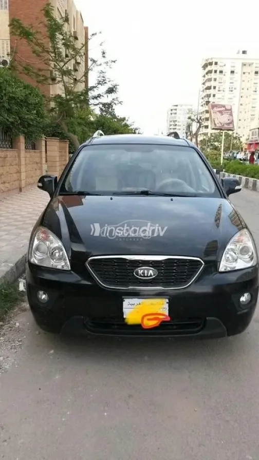 كيا كارينز 2011 أسود مستعملة للبيع - 1