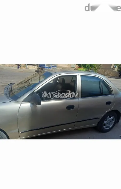 هيونداي اكسنت 2005 فضي مستعملة للبيع - 1