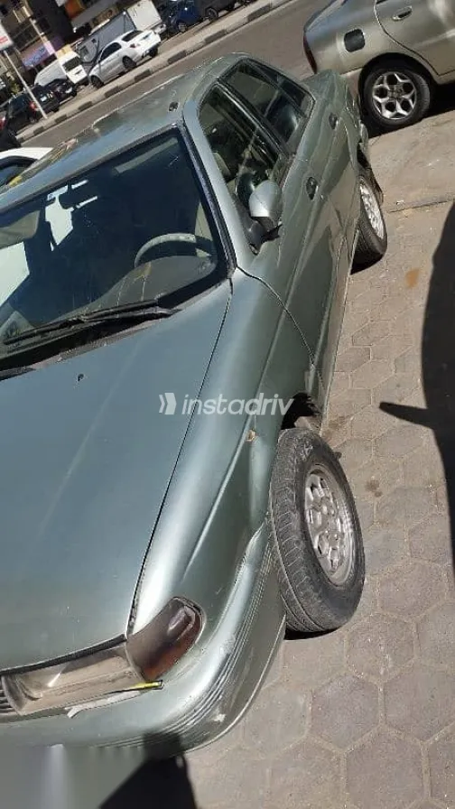 نيسان صنى 1994 فضي مستعملة للبيع - 2
