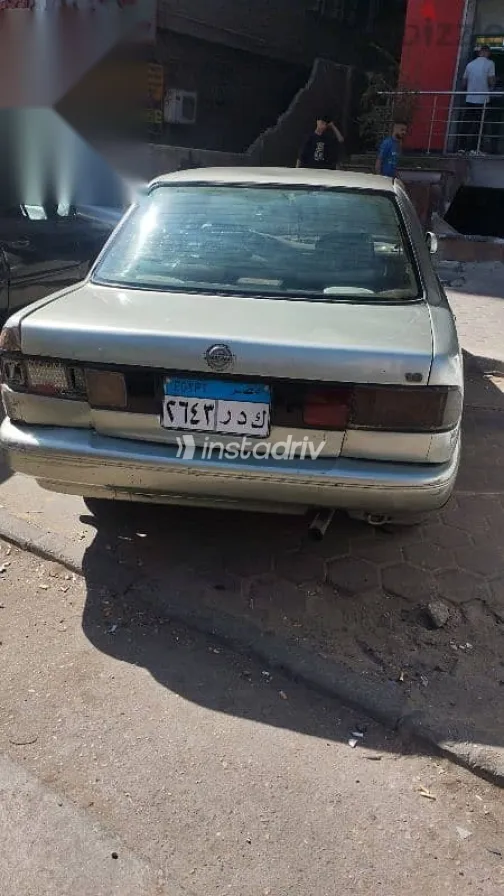 نيسان صنى 1994 فضي مستعملة للبيع - 4