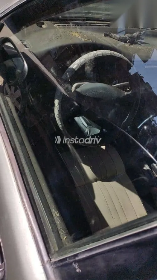 نيسان صنى 1994 فضي مستعملة للبيع - 7