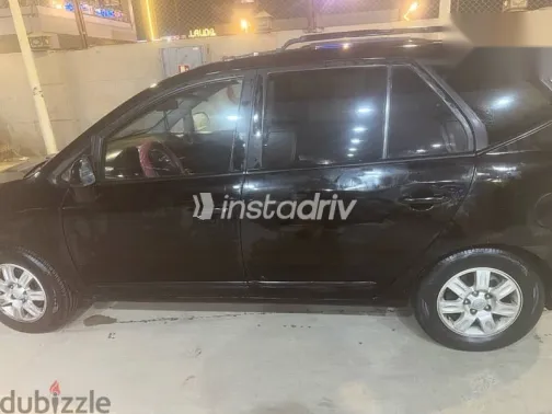 كيا كارينز 2010 أسود مستعملة للبيع - 2
