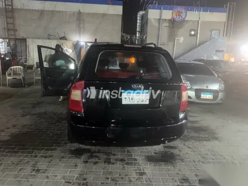 كيا كارينز 2010 أسود مستعملة للبيع - 4