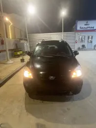 كيا كارينز 2010 أسود مستعملة للبيع