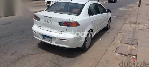 ميتسوبيشي لانسر 2011 أبيض مستعملة للبيع - 1