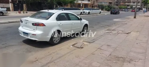 ميتسوبيشي لانسر 2011 أبيض مستعملة للبيع - 8