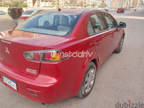 ميتسوبيشي لانسر 2014 أحمر مستعملة للبيع - 2