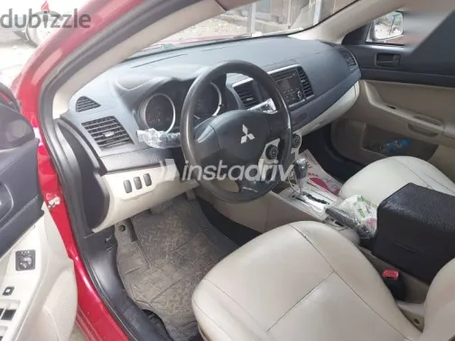 ميتسوبيشي لانسر 2014 أحمر مستعملة للبيع - 6