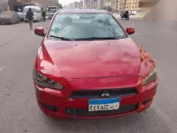 ميتسوبيشي لانسر 2014 أحمر مستعملة للبيع