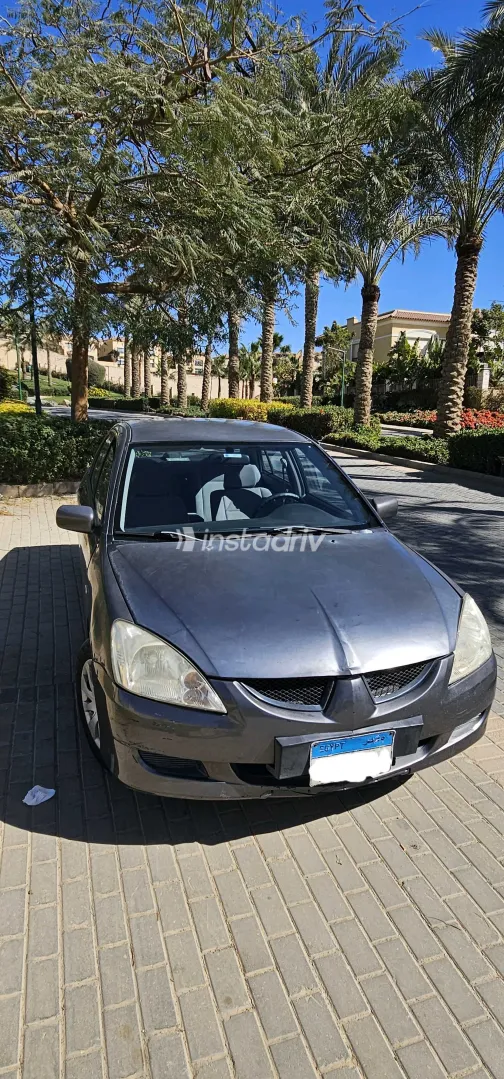 ميتسوبيشي لانسر 2006 أبيض مستعملة للبيع - 1