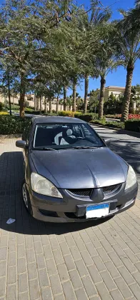 ميتسوبيشي لانسر 2006 أبيض مستعملة للبيع