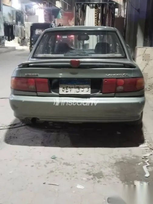 ميتسوبيشي لانسر 1993 رمادي مستعملة للبيع - 1