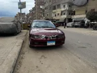 ميتسوبيشي لانسر كرستالة 1999 أحمر غامق مستعملة للبيع