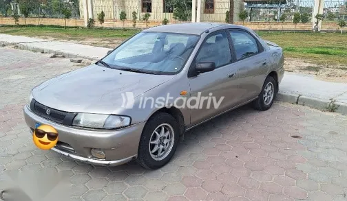 Mazda 323 1998 Gold Used for Sale - 1