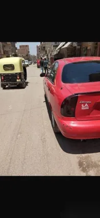 دايو لانوس 2002 أحمر مستعملة للبيع