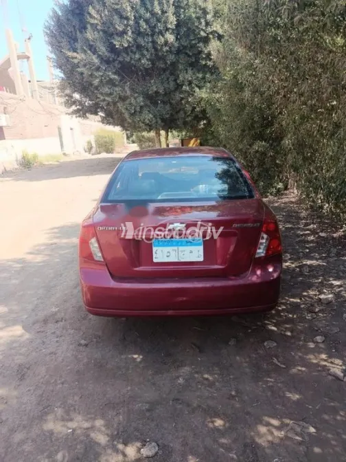 شيفروليه أوبترا 2010 أحمر مستعملة للبيع - 2