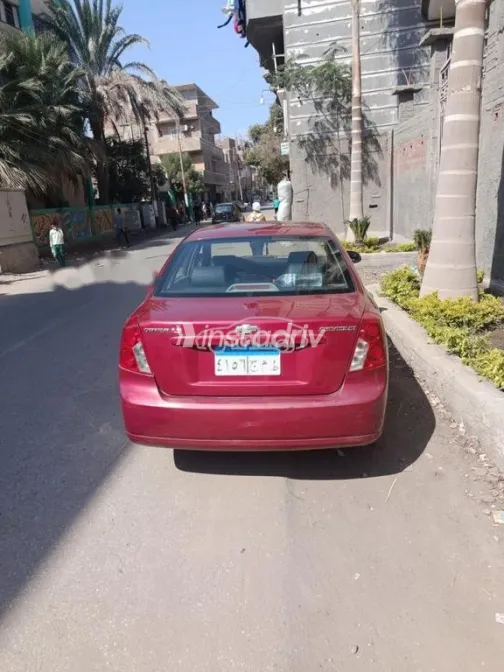 شيفروليه أوبترا 2010 أحمر مستعملة للبيع - 5