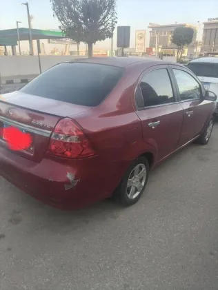 شيفروليه افيو 2014 أحمر مستعملة للبيع