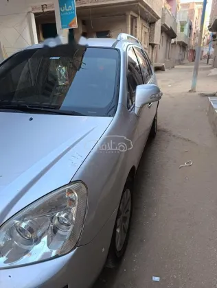 كيا كارينز 2013 فضي مستعملة للبيع