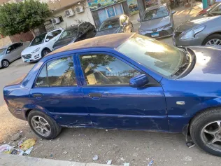 مازدا 323 2001 أبيض مستعملة للبيع