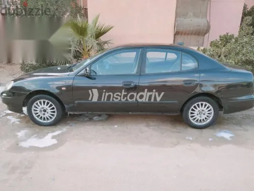 دايو ليوجانزا 1999 أسود مستعملة للبيع - 1