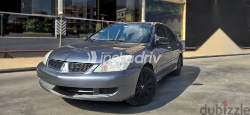 ميتسوبيشي لانسر 2010 فضي مستعملة للبيع - 1