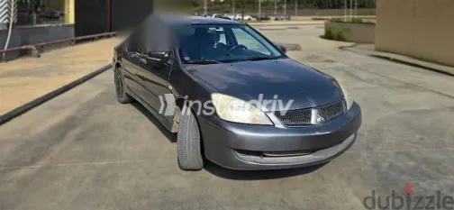 ميتسوبيشي لانسر 2010 فضي مستعملة للبيع - 2