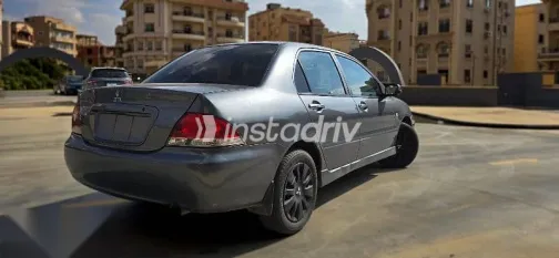 ميتسوبيشي لانسر 2010 فضي مستعملة للبيع - 4