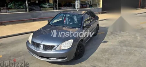 ميتسوبيشي لانسر 2010 فضي مستعملة للبيع - 5