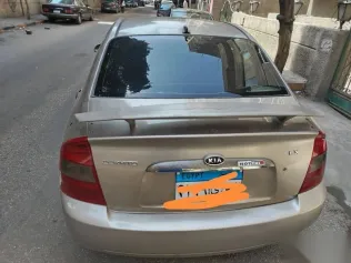 كيا سيراتو 2006 ذهبي مستعملة للبيع
