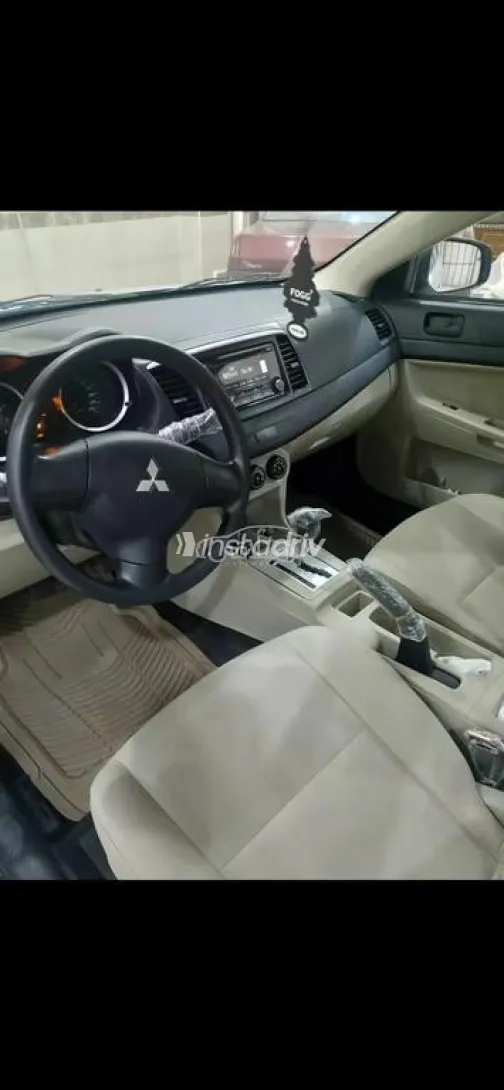 ميتسوبيشي لانسر اى اكس شارك 2015 فضي مستعملة للبيع - 1