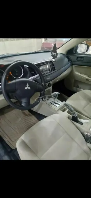 ميتسوبيشي لانسر اى اكس شارك 2015 فضي مستعملة للبيع