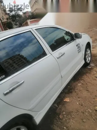 ميتسوبيشي لانسر 2008 أبيض مستعملة للبيع