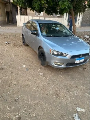 ميتسوبيشي لانسر اى اكس شارك 2016 فضي مستعملة للبيع