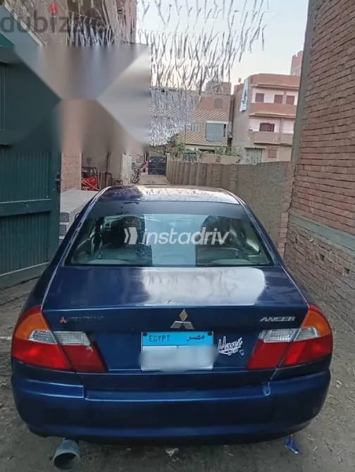 ميتسوبيشي لانسر 1999 أزرق غامق مستعملة للبيع - 2