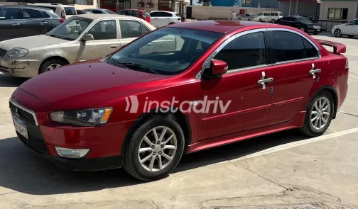 ميتسوبيشي لانسر اى اكس شارك 2015 أحمر غامق مستعملة للبيع - 1