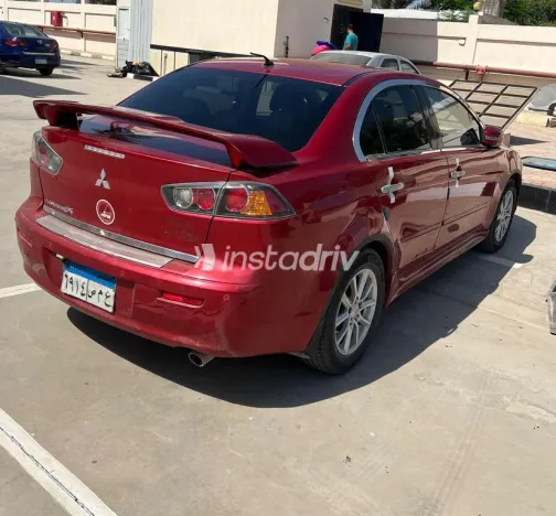 ميتسوبيشي لانسر اى اكس شارك 2015 أحمر غامق مستعملة للبيع - 4
